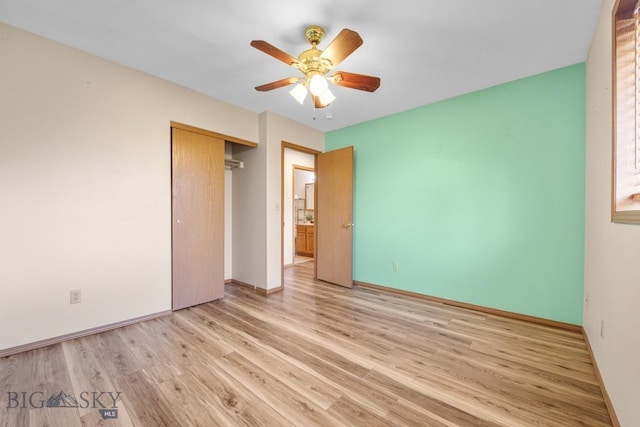 704 Mayfair Dr, Belgrade, MT 59714 - unfurnished bedroom featuring light wood-style floors, a closet, and a ceiling fan