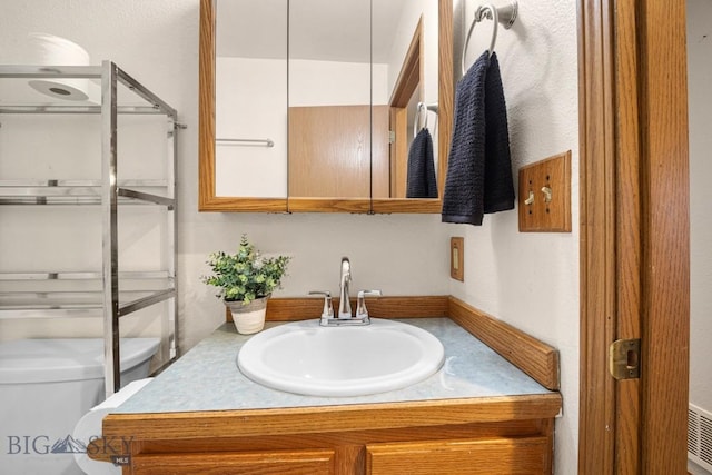 704 Mayfair Dr, Belgrade, MT 59714 - bathroom with toilet and vanity