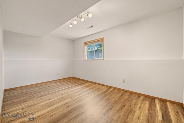 704 Mayfair Dr, Belgrade, MT 59714 - spare room with light wood-style floors and rail lighting