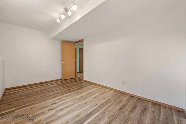 704 Mayfair Dr, Belgrade, MT 59714 - spare room featuring light wood-style flooring and baseboards