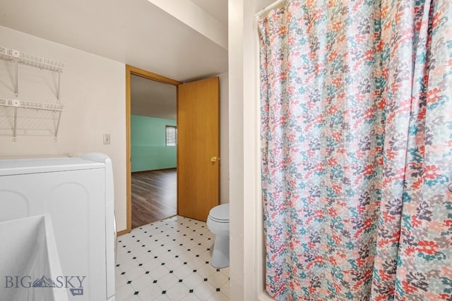 704 Mayfair Dr, Belgrade, MT 59714 - bathroom featuring washer / dryer and curtained shower