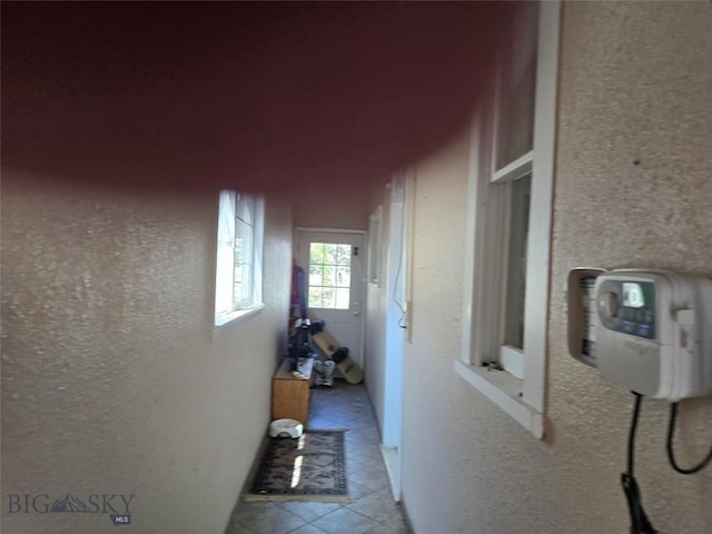 415 W 6th St, Anaconda, MT 59711 - hallway with a textured wall and tile patterned flooring
