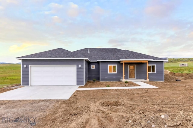 20 Hollow Top Trl, Three Forks, MT 59752 - view of front of property with concrete driveway, a garage, and a shingled roof