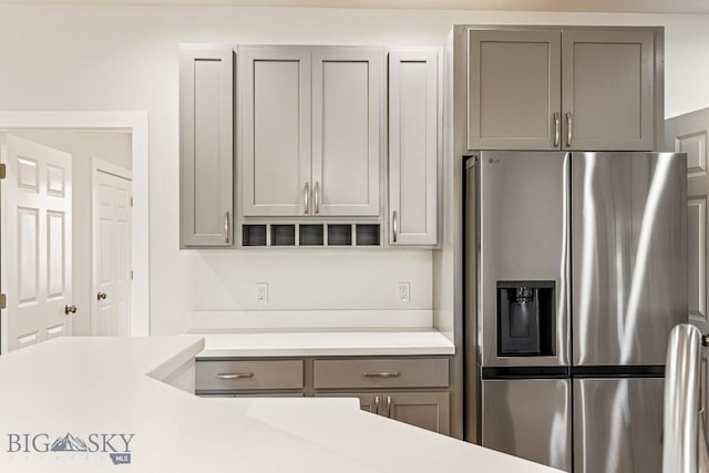 20 Hollow Top Trl, Three Forks, MT 59752 - kitchen featuring stainless steel refrigerator with ice dispenser, gray cabinetry, and light countertops