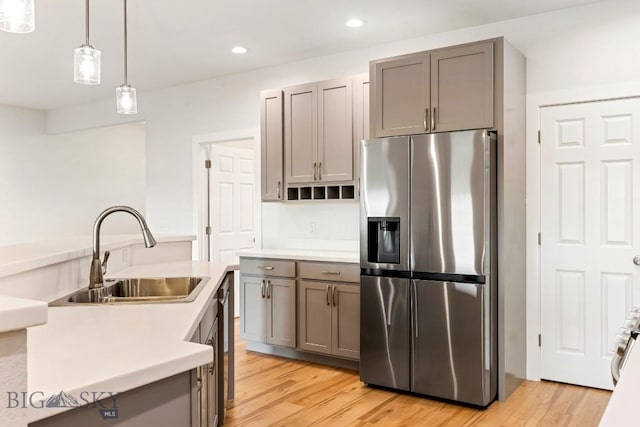 20 Hollow Top Trl, Three Forks, MT 59752 - kitchen with stainless steel refrigerator with ice dispenser, gray cabinets, light countertops, light wood-style floors, and recessed lighting