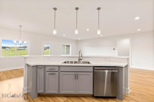 20 Hollow Top Trl, Three Forks, MT 59752 - kitchen featuring dishwasher, gray cabinetry, a kitchen island with sink, light countertops, and hanging light fixtures