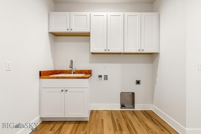 20 Hollow Top Trl, Three Forks, MT 59752 - washroom with light wood-type flooring, hookup for an electric dryer, cabinet space, and washer hookup