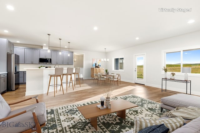 20 Hollow Top Trl, Three Forks, MT 59752 - living room featuring recessed lighting, light wood-type flooring, and a chandelier