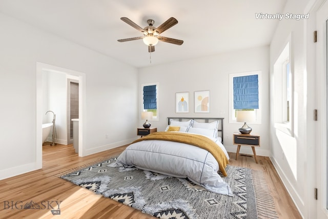 20 Hollow Top Trl, Three Forks, MT 59752 - bedroom with light wood finished floors, connected bathroom, and ceiling fan
