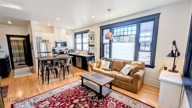 101 W Quartz Unit 1A, Butte, MT 59701 - living room with light wood-style floors and recessed lighting