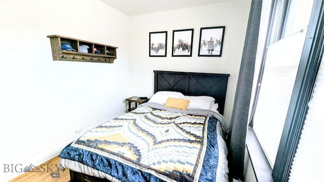 101 W Quartz Unit 1A, Butte, MT 59701 - bedroom featuring wood finished floors and baseboards