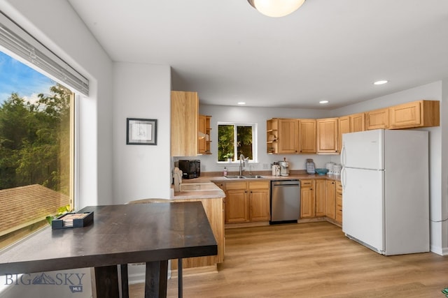 1203 Wineglass Ct Unit B, Livingston, MT 59047 - kitchen featuring freestanding refrigerator, dishwasher, open shelves, light countertops, and light wood-style flooring