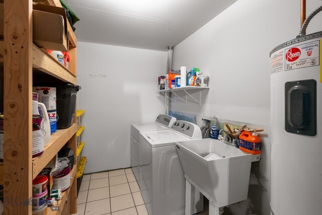 1203 Wineglass Ct Unit B, Livingston, MT 59047 - washroom featuring electric water heater, washing machine and dryer, and light tile patterned flooring
