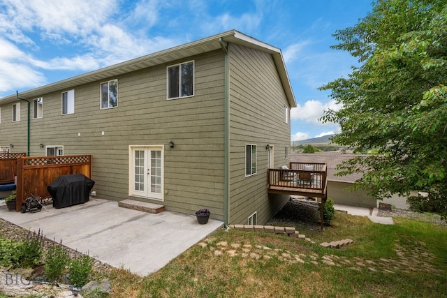 1203 Wineglass Ct Unit B, Livingston, MT 59047 - back of house featuring french doors, a deck, and a patio