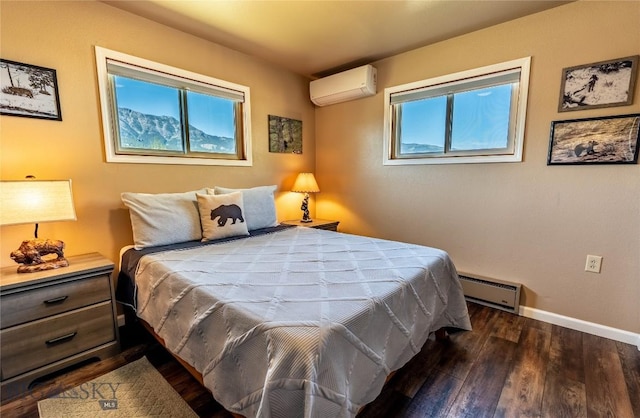 14 Peters Ln, Gardiner, MT 59030 - bedroom featuring a wall mounted air conditioner, a baseboard heating unit, and wood finished floors