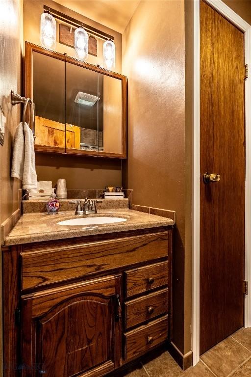 14 Peters Ln, Gardiner, MT 59030 - bathroom with vanity and tile patterned floors