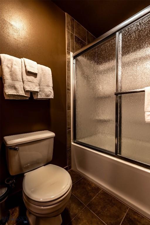 14 Peters Ln, Gardiner, MT 59030 - bathroom with bath / shower combo with glass door and tile patterned flooring