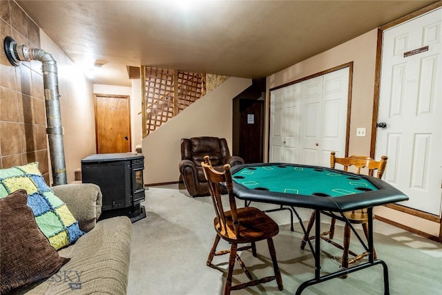14 Peters Ln, Gardiner, MT 59030 - game room featuring a wood stove and carpet