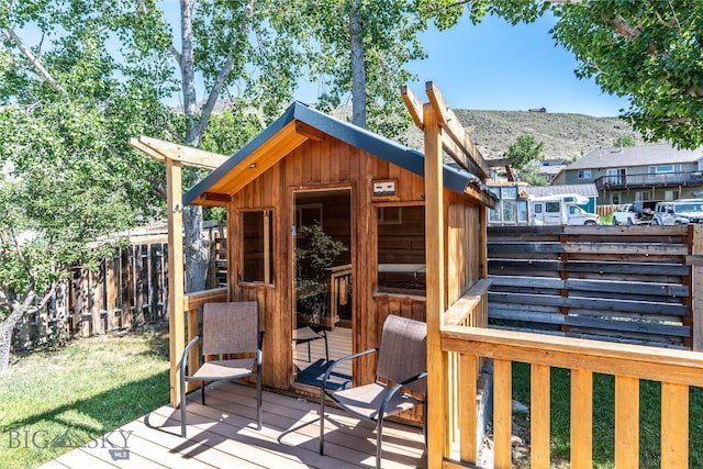 14 Peters Ln, Gardiner, MT 59030 - wooden deck featuring an outdoor structure and a mountain view
