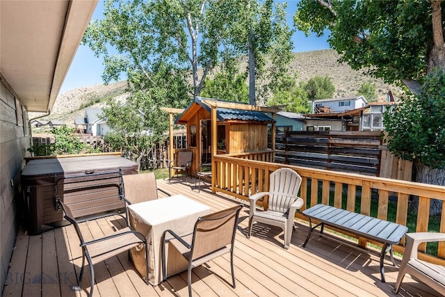 14 Peters Ln, Gardiner, MT 59030 - wooden deck featuring a hot tub and a mountain view