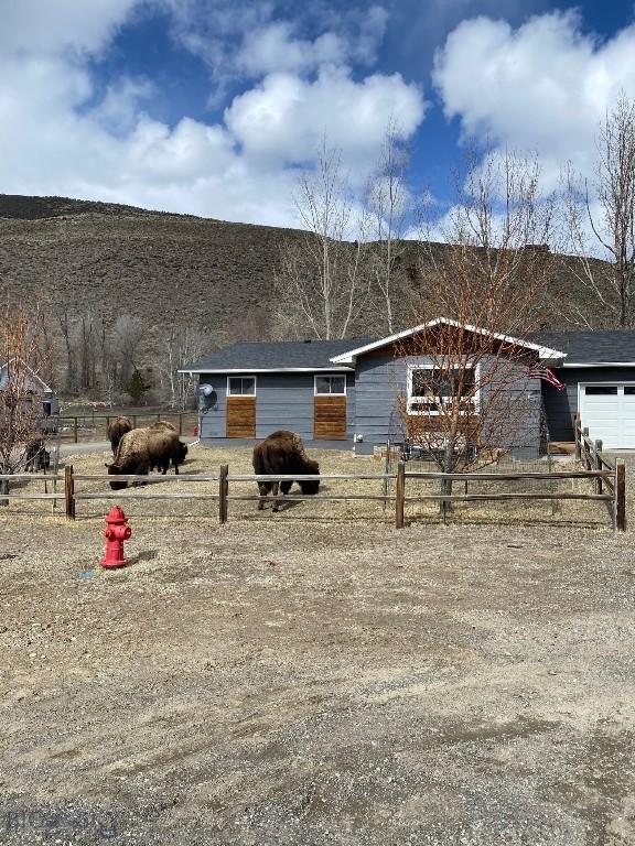 14 Peters Ln, Gardiner, MT 59030 - view of front facade with a garage and a view of countryside