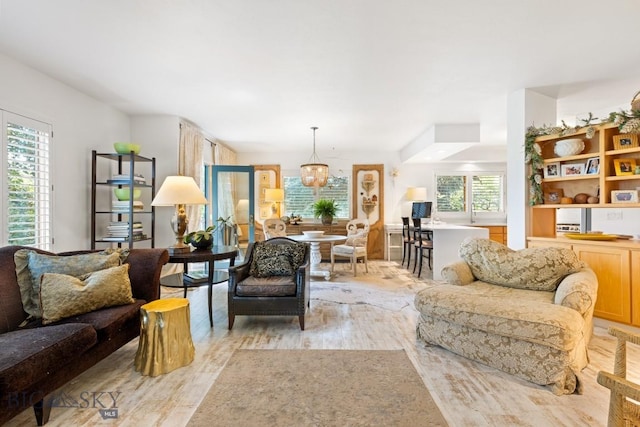 1037 Boylan Rd Unit 1, Bozeman, MT 59715 - living area featuring light wood-style floors and a chandelier