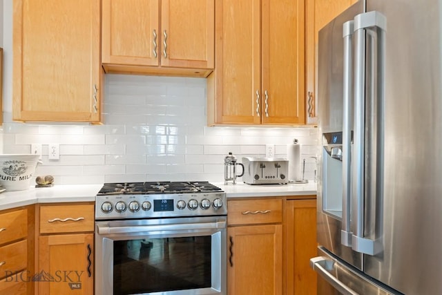 1037 Boylan Rd Unit 1, Bozeman, MT 59715 - kitchen with stainless steel appliances, light countertops, and decorative backsplash