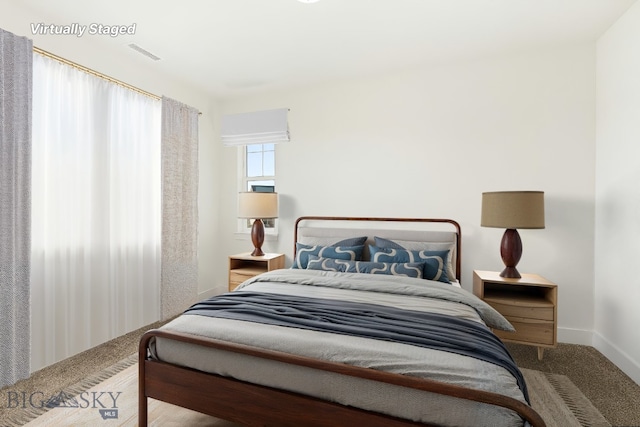 1606 Wyatt Earp Ct, Belgrade, MT 59714 - carpeted bedroom with baseboards