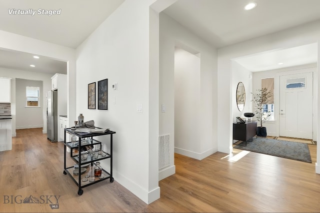 1606 Wyatt Earp Ct, Belgrade, MT 59714 - hall with light wood-type flooring and recessed lighting
