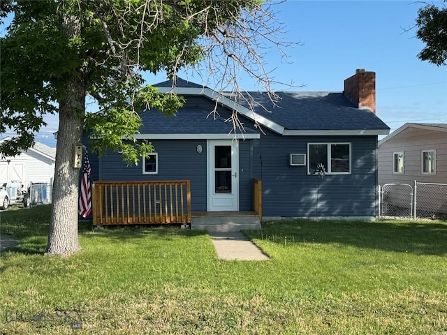 512 W 4th Ave, Big Timber, MT 59011 - back of house with a shingled roof, a chimney, and a deck