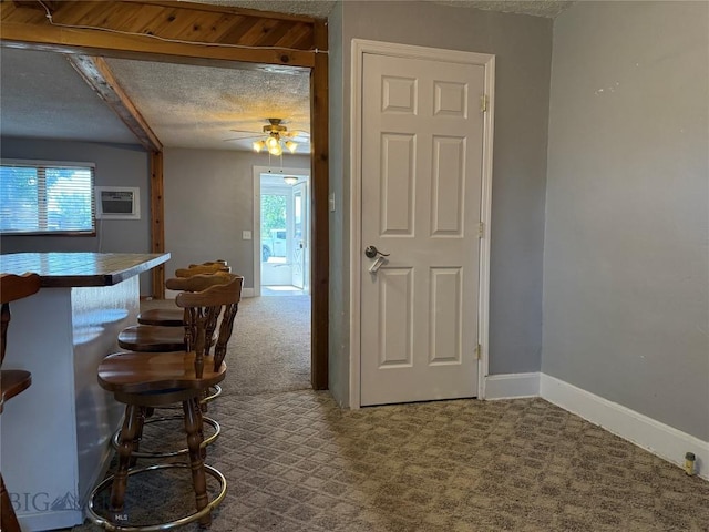 512 W 4th Ave, Big Timber, MT 59011 - dining space with carpet floors, a textured ceiling, ceiling fan, and a dry bar
