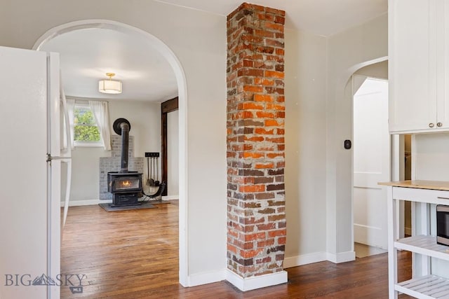 209 N 3rd Ave, Bozeman, MT 59715 - hallway with arched walkways and wood finished floors