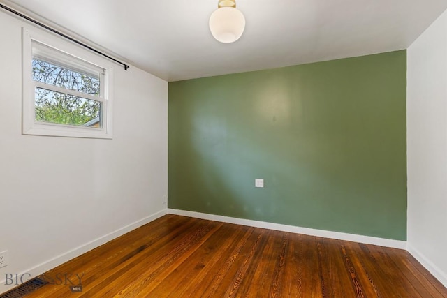 209 N 3rd Ave, Bozeman, MT 59715 - empty room with baseboards and dark wood finished floors