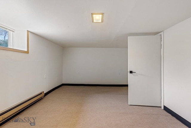 209 N 3rd Ave, Bozeman, MT 59715 - bonus room with a baseboard heating unit and light carpet