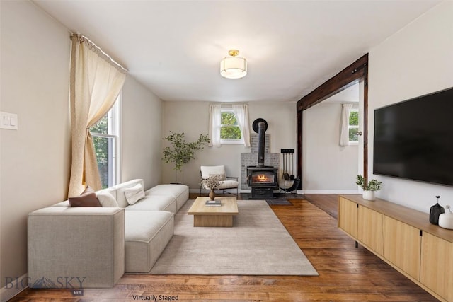 209 N 3rd Ave, Bozeman, MT 59715 - living room featuring dark wood-style flooring and a wood stove