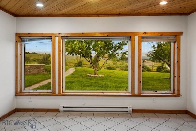 181 Pheasant Ln, Belgrade, MT 59714 - spare room featuring baseboard heating, recessed lighting, light tile patterned floors, and wood ceiling