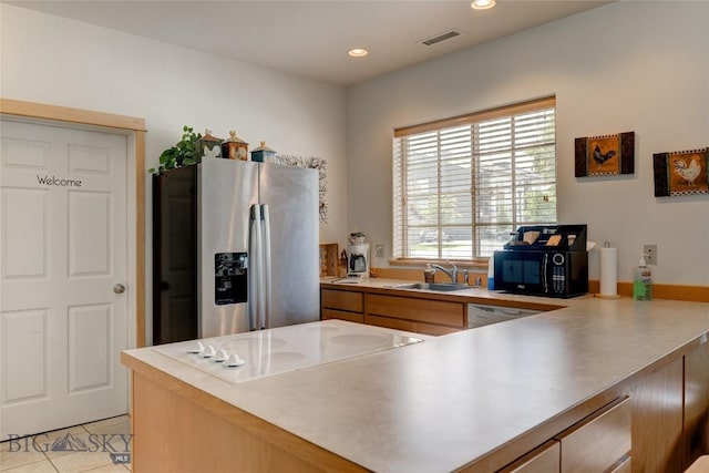 2221 Willow Unit 201-B, Livingston, MT 59047 - kitchen with stainless steel refrigerator with ice dispenser, black microwave, electric cooktop, light countertops, and recessed lighting