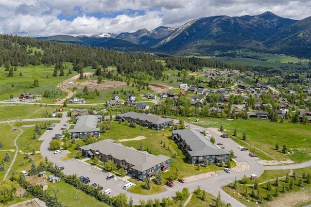 120 Firelight Dr Unit C10, Big Sky, MT 59716 - aerial perspective of suburban area with mountains and a heavily wooded area
