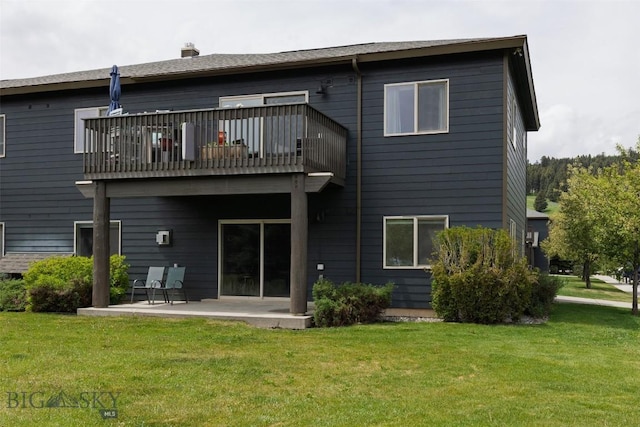 120 Firelight Dr Unit C10, Big Sky, MT 59716 - rear view of property featuring a balcony, a patio, a yard, and a chimney
