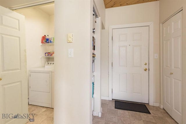 120 Firelight Dr Unit C10, Big Sky, MT 59716 - laundry area with washer / dryer and light tile patterned floors