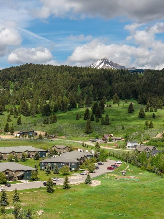 120 Firelight Dr Unit C10, Big Sky, MT 59716 - view of mountain backdrop with a forest