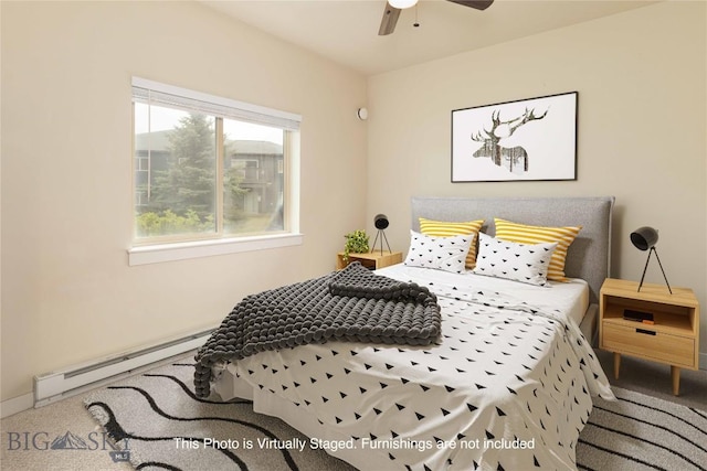 120 Firelight Dr Unit C10, Big Sky, MT 59716 - carpeted bedroom featuring baseboard heating and ceiling fan
