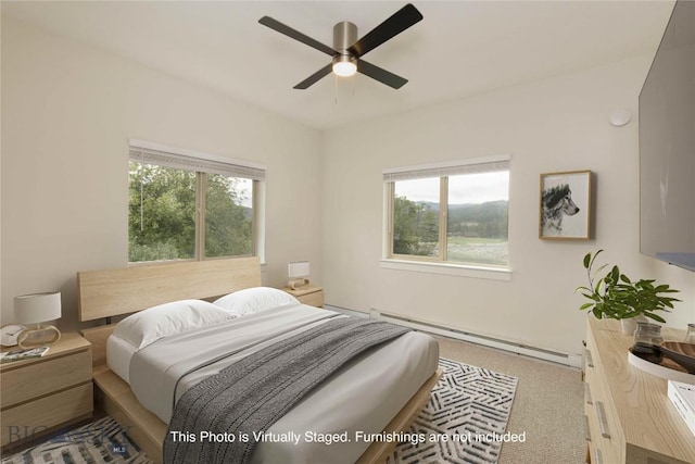 120 Firelight Dr Unit C10, Big Sky, MT 59716 - carpeted bedroom with a baseboard heating unit and ceiling fan