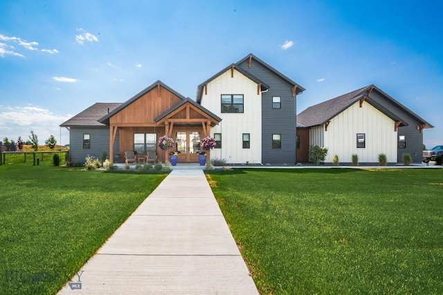 16 Tight Loop Dr, Bozeman, MT 59718 - modern farmhouse with board and batten siding, french doors, and a front lawn