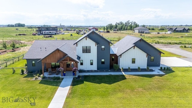 16 Tight Loop Dr, Bozeman, MT 59718 - view of front of property with board and batten siding and a patio