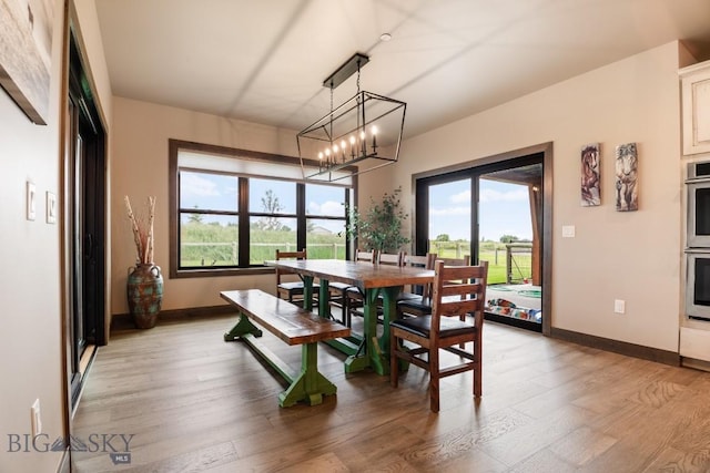 16 Tight Loop Dr, Bozeman, MT 59718 - dining room with light wood finished floors and a chandelier