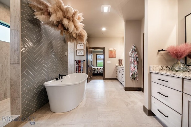 16 Tight Loop Dr, Bozeman, MT 59718 - bathroom with vanity, a freestanding bath, and ensuite bath