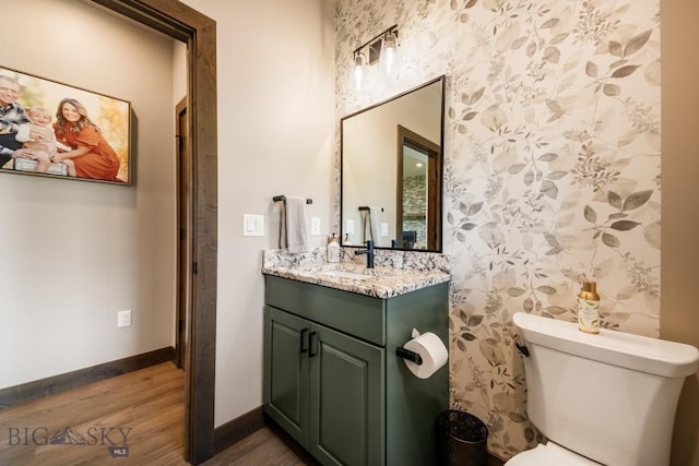 16 Tight Loop Dr, Bozeman, MT 59718 - bathroom with wallpapered walls, wood finished floors, and vanity