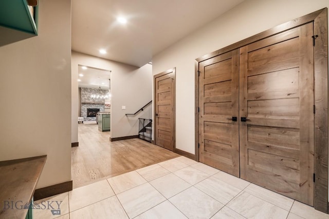 16 Tight Loop Dr, Bozeman, MT 59718 - foyer entrance with a large fireplace, recessed lighting, and light tile patterned floors