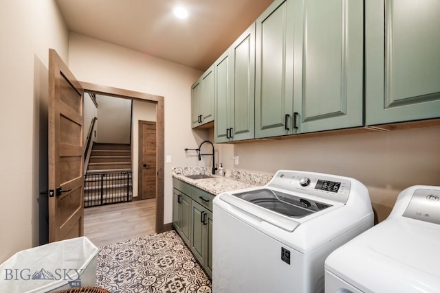 16 Tight Loop Dr, Bozeman, MT 59718 - laundry room with washer and clothes dryer, cabinet space, and light wood-style floors